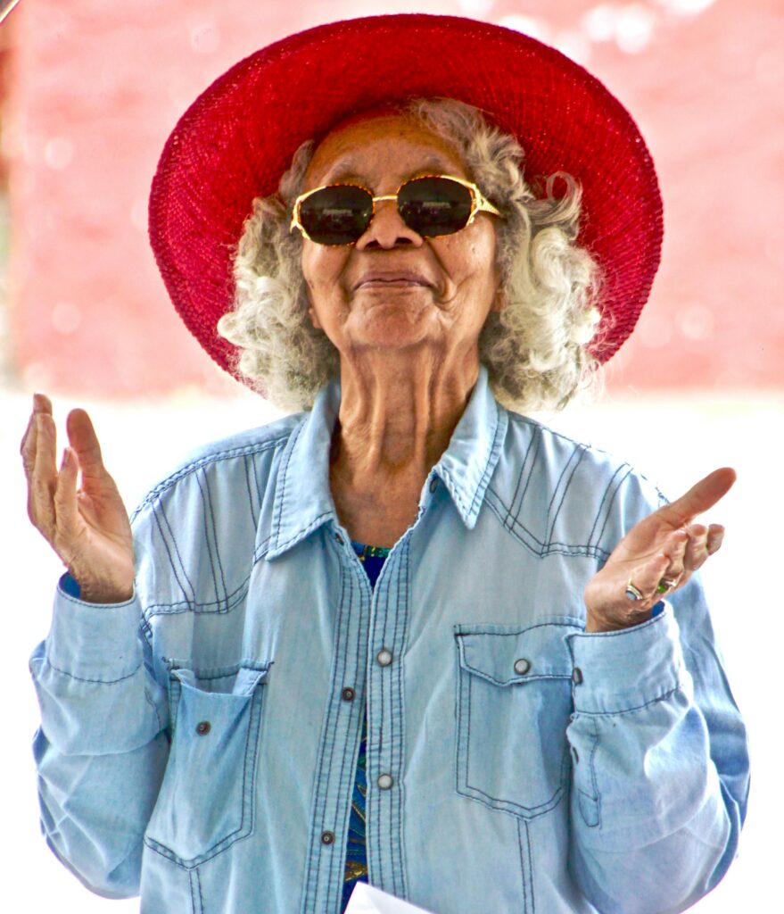 Woman Wearing Red Hat and Sunglasses